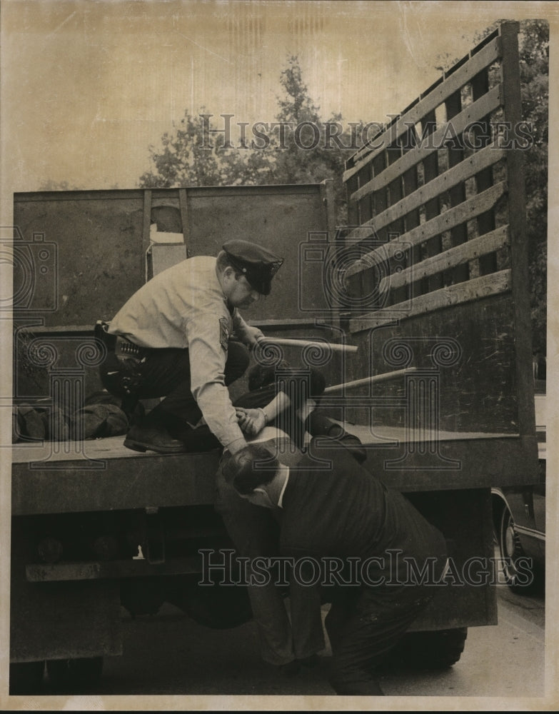 1969 The handcuffed demonstrator during the Davis Cup matches riot - Historic Images