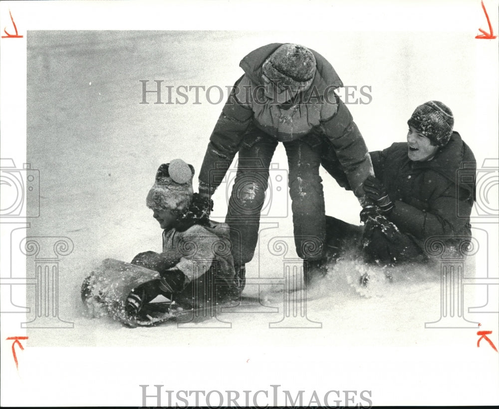 1980 Press Photo Franz &amp; Gary Maruna&amp; John Richardson sled in Cain Park - Historic Images