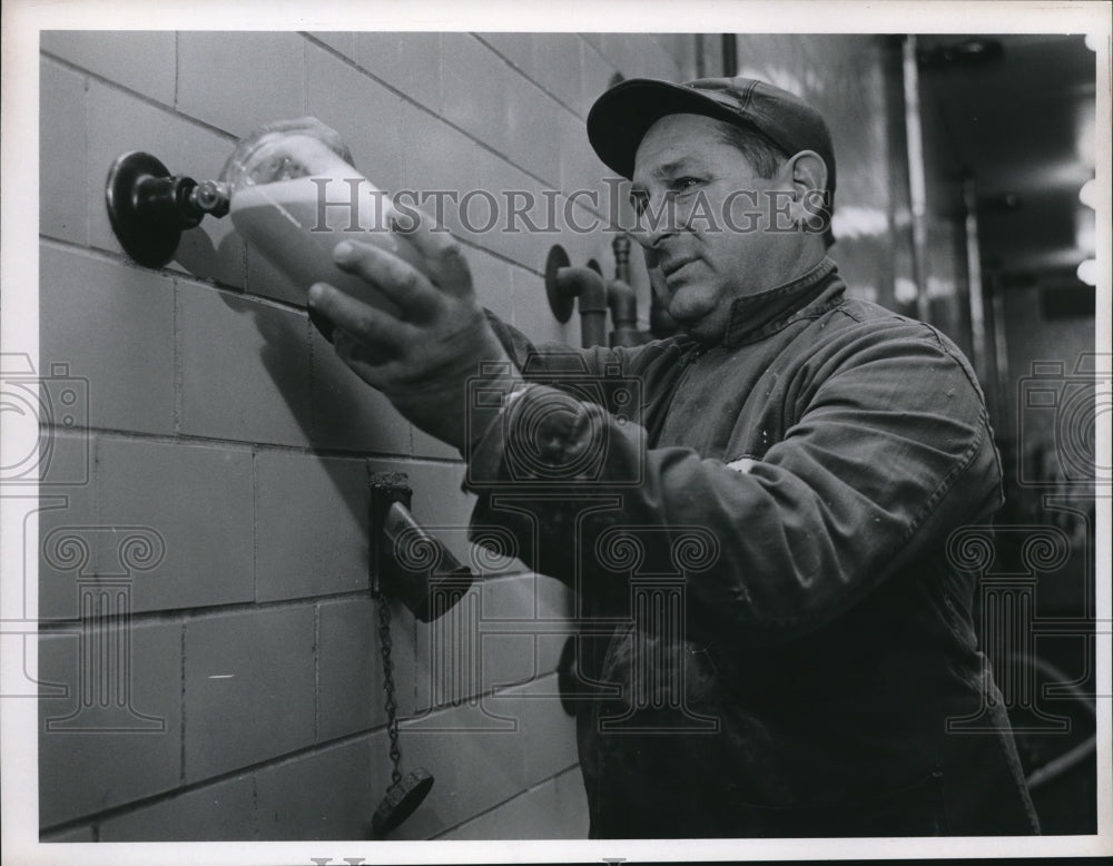 1965 Press Photo Albert Tomas takes a sample from Fermentation Tank of Carling - Historic Images