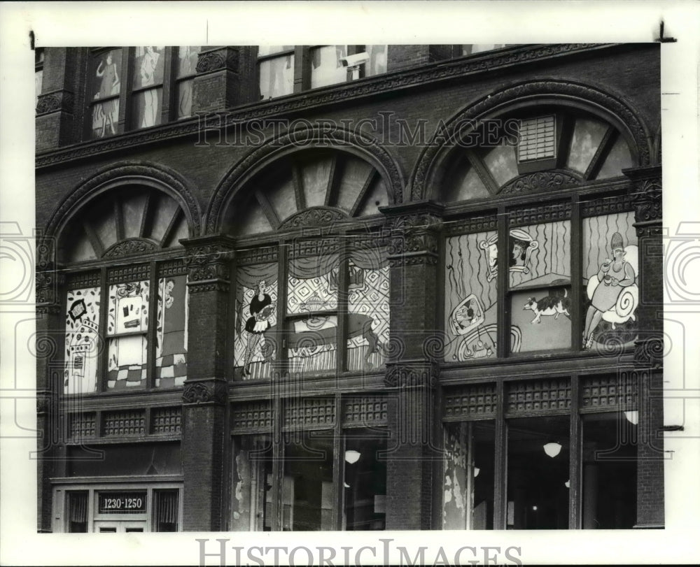 1986 Press Photo Cartoon like scenes painted at the Roof-Mc Bride Building. - Historic Images
