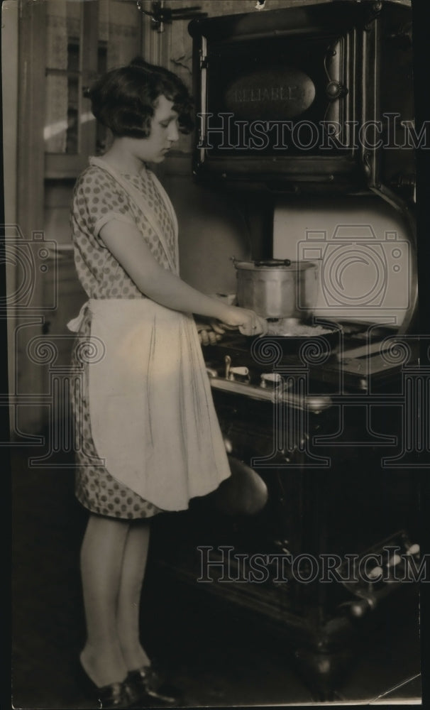 1927 Press Photo Christine Zagorc cooking scrambled eggs - cva85676 - Historic Images
