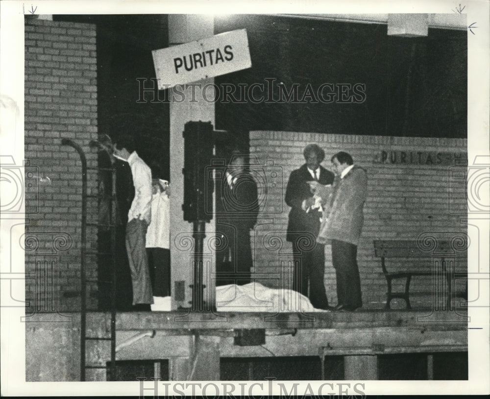 1984 Press Photo Puritas Rapid Stop shooting body of suspect - Historic Images