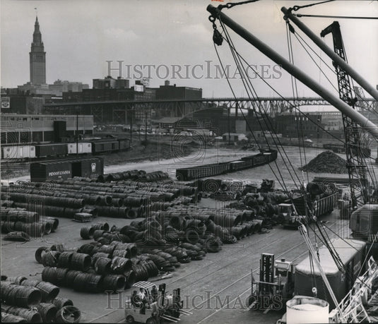 1964 A filed of coils and plates resting under from the Norwegian - Historic Images