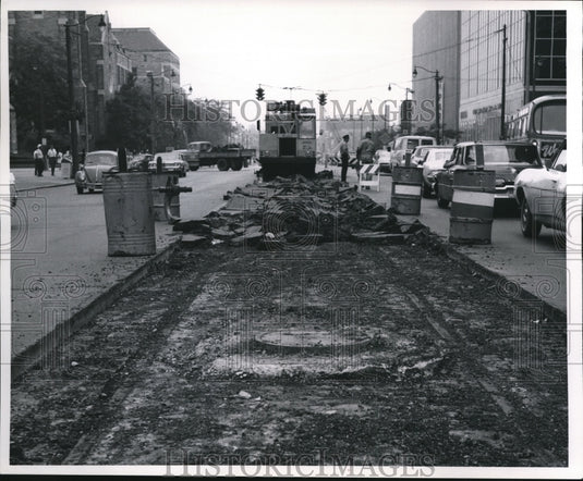 1970 Street car tracks uncovered at Superior Ave between 6th & 9th - Historic Images