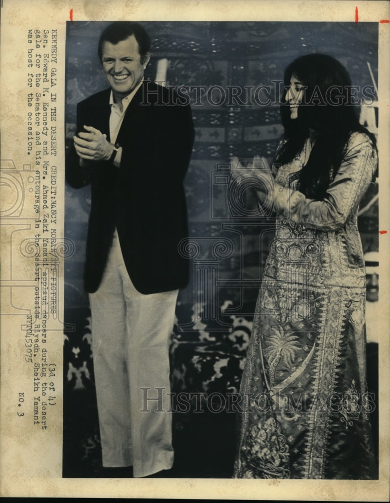 1975 Press Photo Sen. Edward Kennedy and Mrs. Ahmed Zaki Yamani in gala desert. - Historic Images