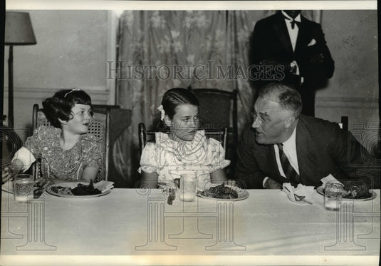 1937, Two small hosts, and honored guest at Warm Springs dinner. - Historic Images