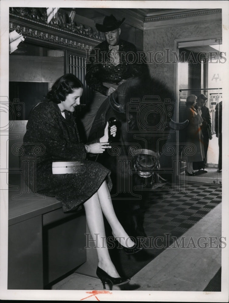 Press Photo Doris O&#39;Donnell placing a telephone on a bull&#39;s ear - cvb09742 - Historic Images