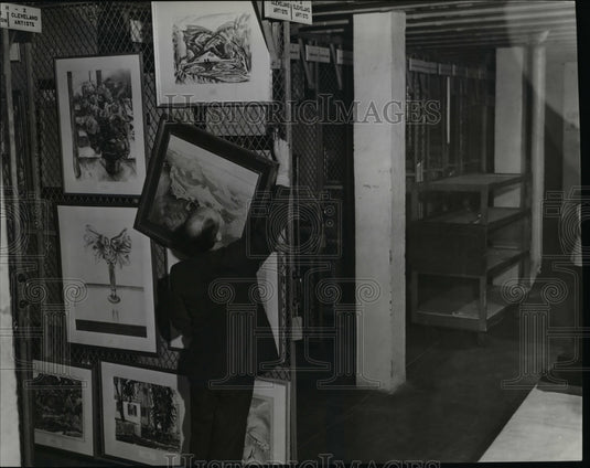 1946, The curator, Mr. Francis, shown making selections. - cvb10132 - Historic Images