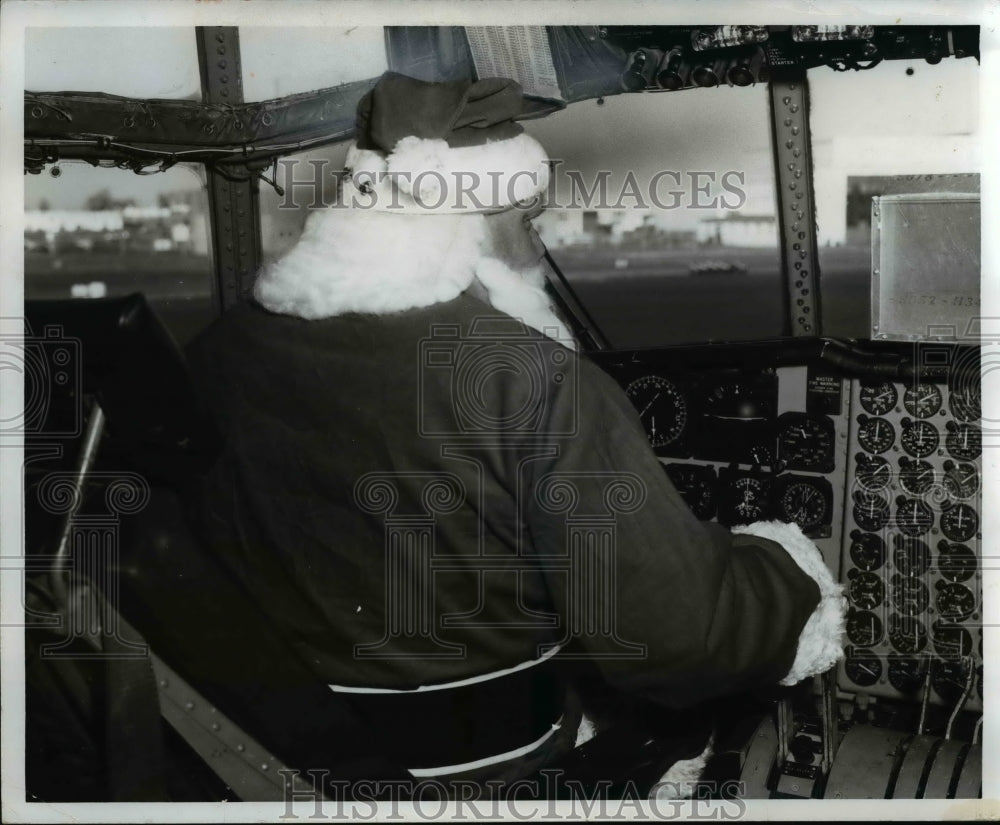 1967 Santa Claus at controls of USAF C-130 cargo plane-Historic Images