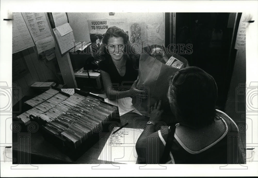 1983, Mary Clare Gives Food at Weside Ecumanical Hunger Center - Historic Images