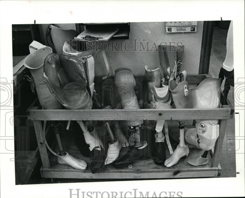 1991 Press Photo Repaired limbs are stored in a corner of the shop for delivery - Historic Images