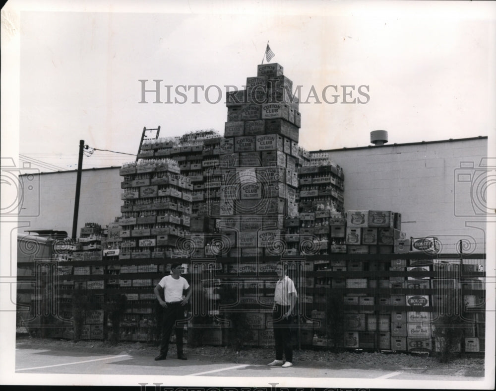 1964, Cause of empty pop bottles, piling up because of the strike - Historic Images