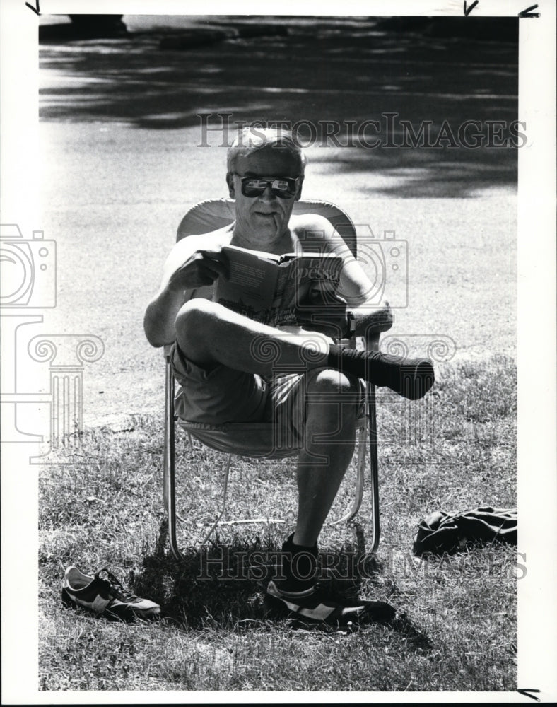 1988, Paul Bohn- Metroparks Rocky River Reservation-book reading - Historic Images