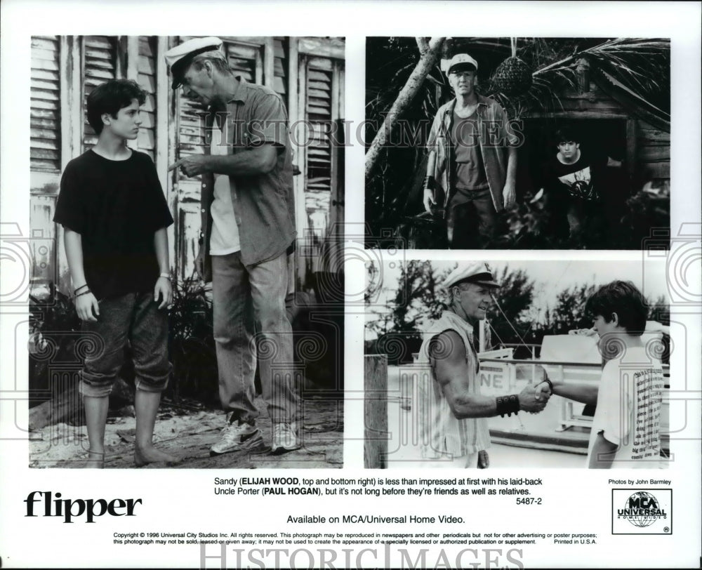 1996 Press Photo Elijah Wood and Paul Hogan in Scenes from Flipper - cvb15639 - Historic Images