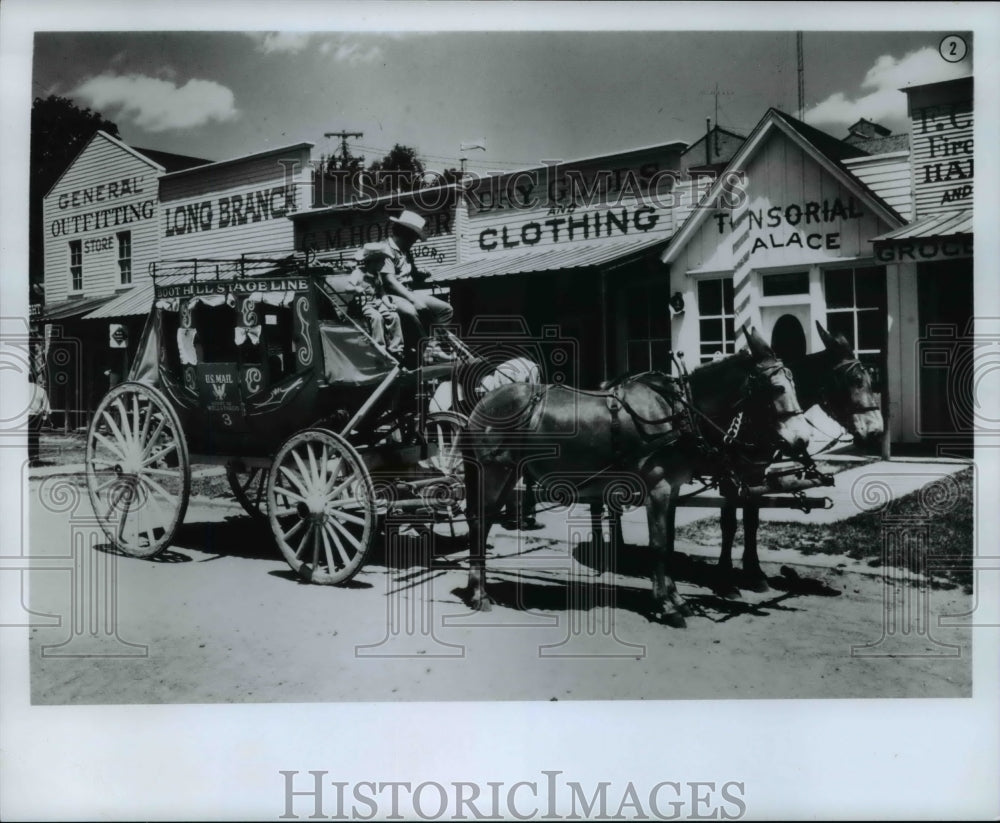 Press Photo A young boy takes a ride on Boot Hill Stage Line run in Dodge City - Historic Images