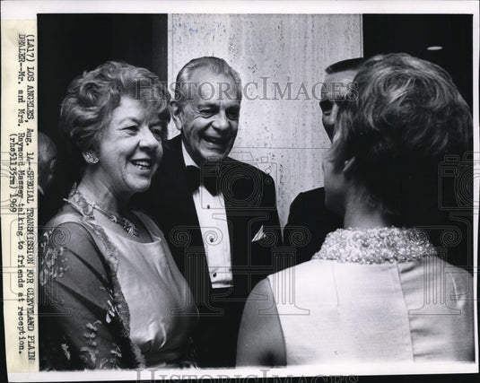 1969, Mr & Mrs Raymond Massey talking to friends at reception - Historic Images