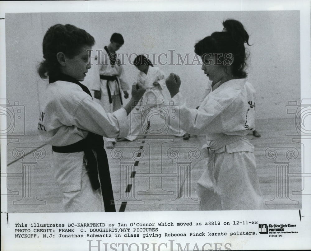 1988 Press Photo Jonathan Schwartz in class giving Rebecca Pinck karate pointers - Historic Images
