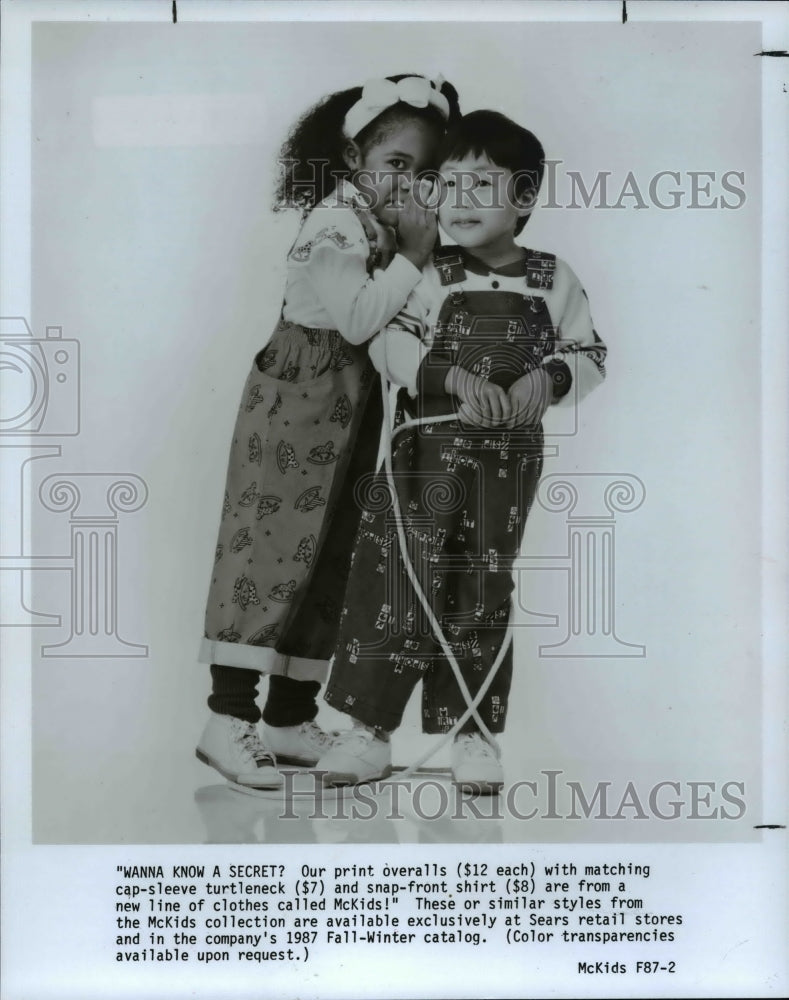 1987 Press Photo &quot;Wanna know a secret?&quot; New line of clothes called McKIds. - Historic Images