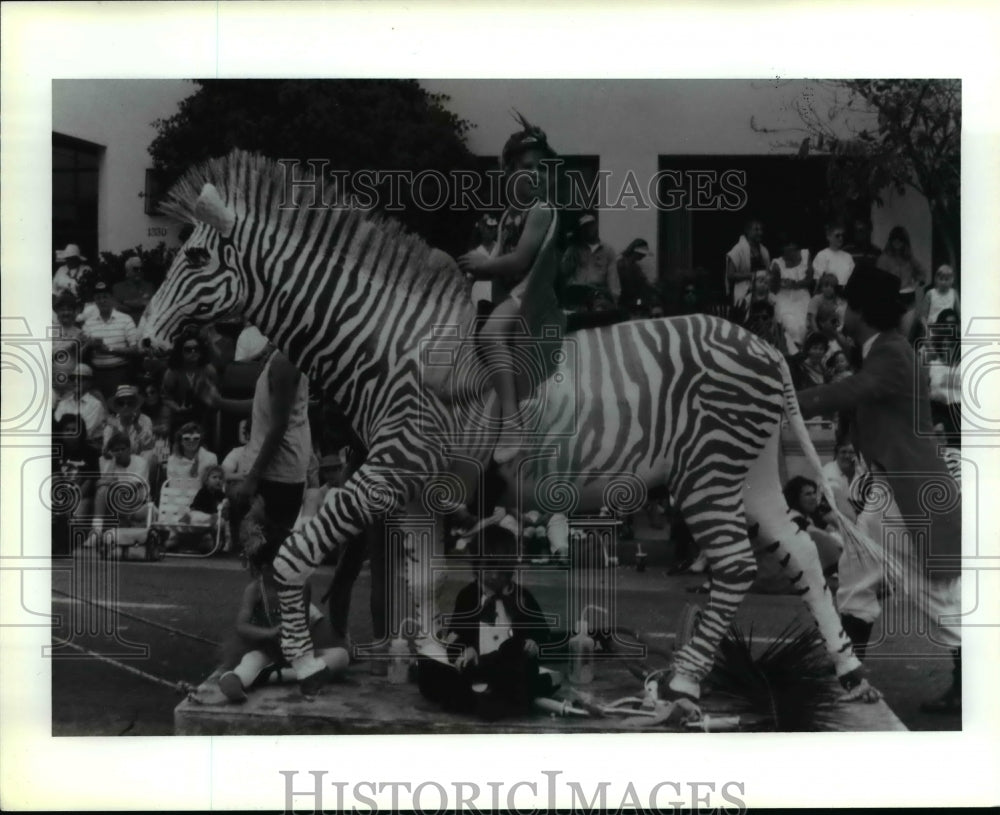 1996 Press Photo Little girl rides faux Zebra in parade - cvb23385 - Historic Images