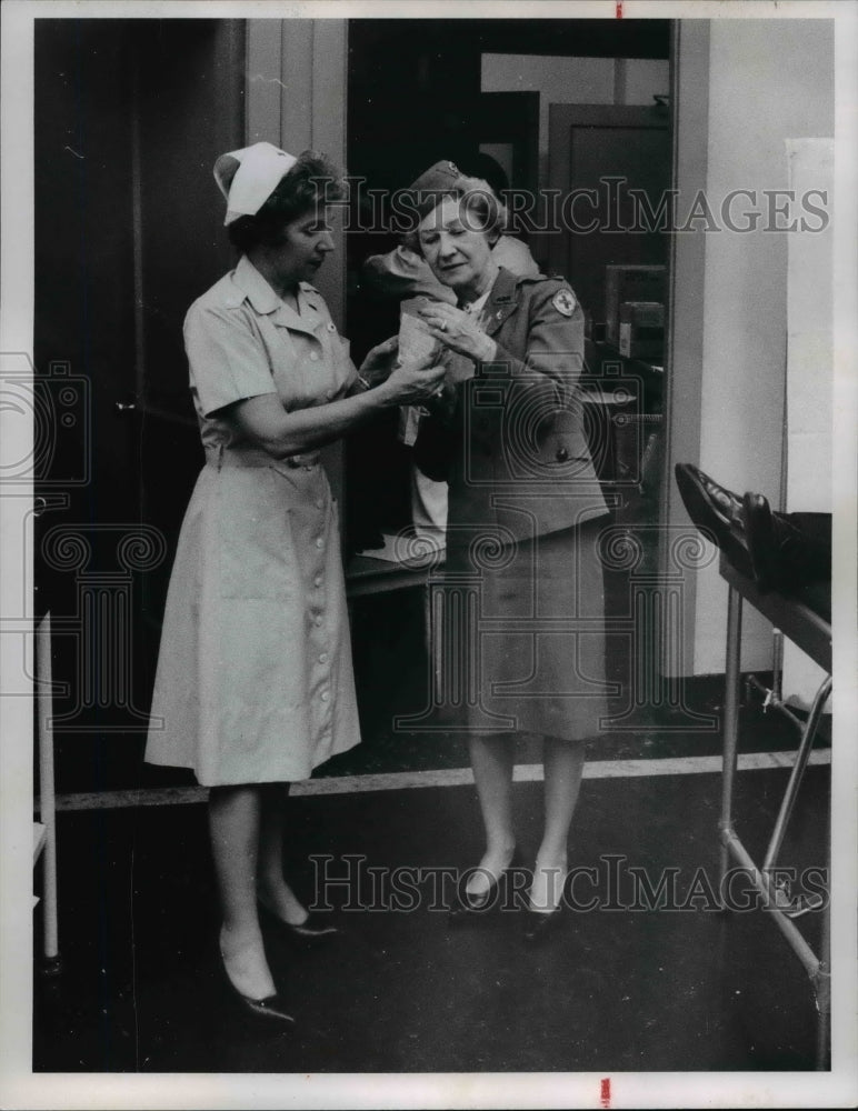 1966, Mrs Thomas and Mrs Hanson with the American Red Cross - Historic Images