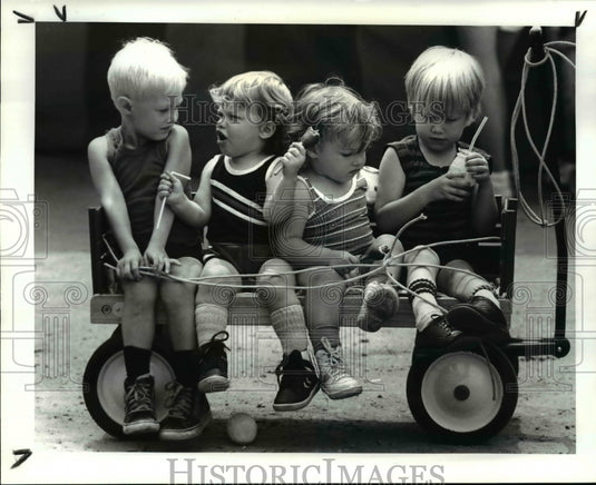 1987, Mini Mardi Gras attendees have snack at Fairport Harbor grounds - Historic Images