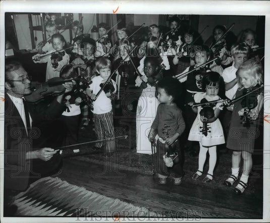 1973 Robert Flanik, talks to a class of youngsters in Suzuki Method-Historic Images