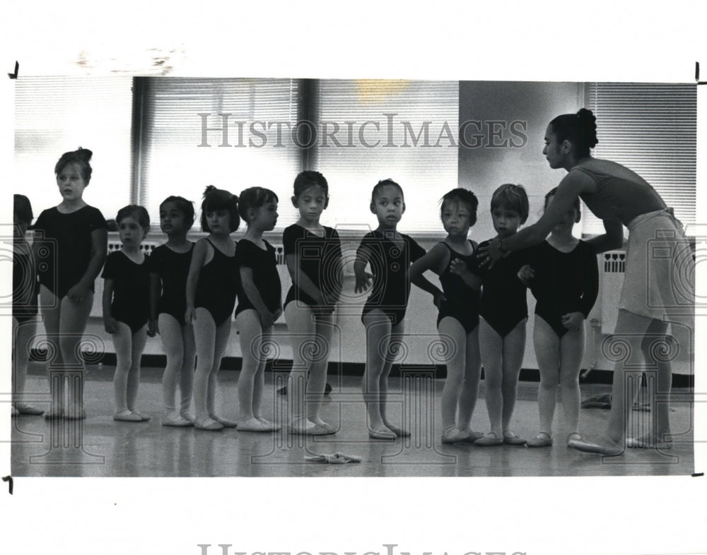 1991, Pre-ballet dancers ages 3-5 line up to try hand at a jump drill - Historic Images