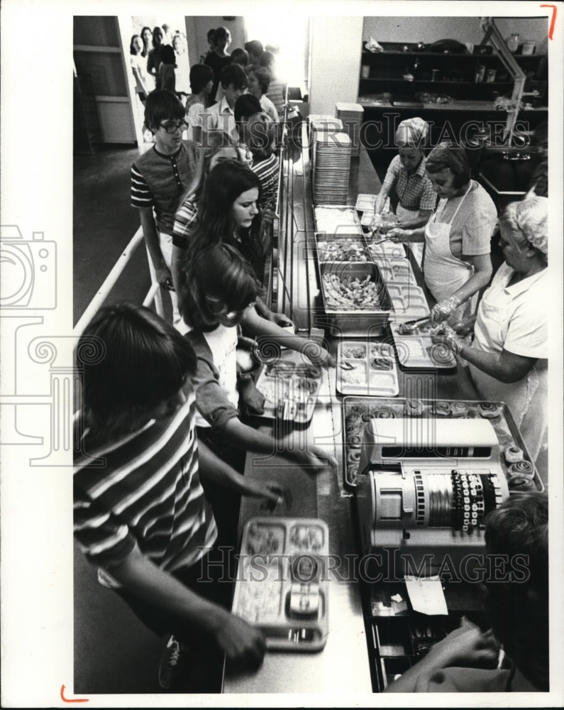 1975 Kids line up for hot lunch served on school cafeteria-Historic Images