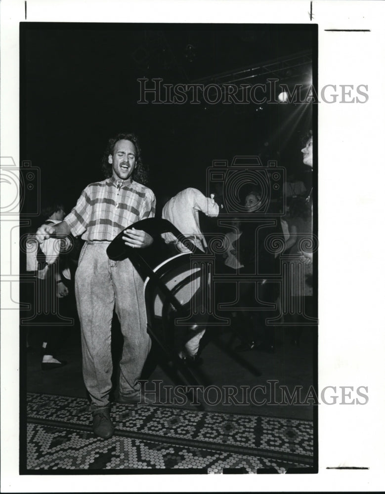 1989, Bohdan Germaga of Cleveland dances with a chair at Hank&#39;s cafe - Historic Images