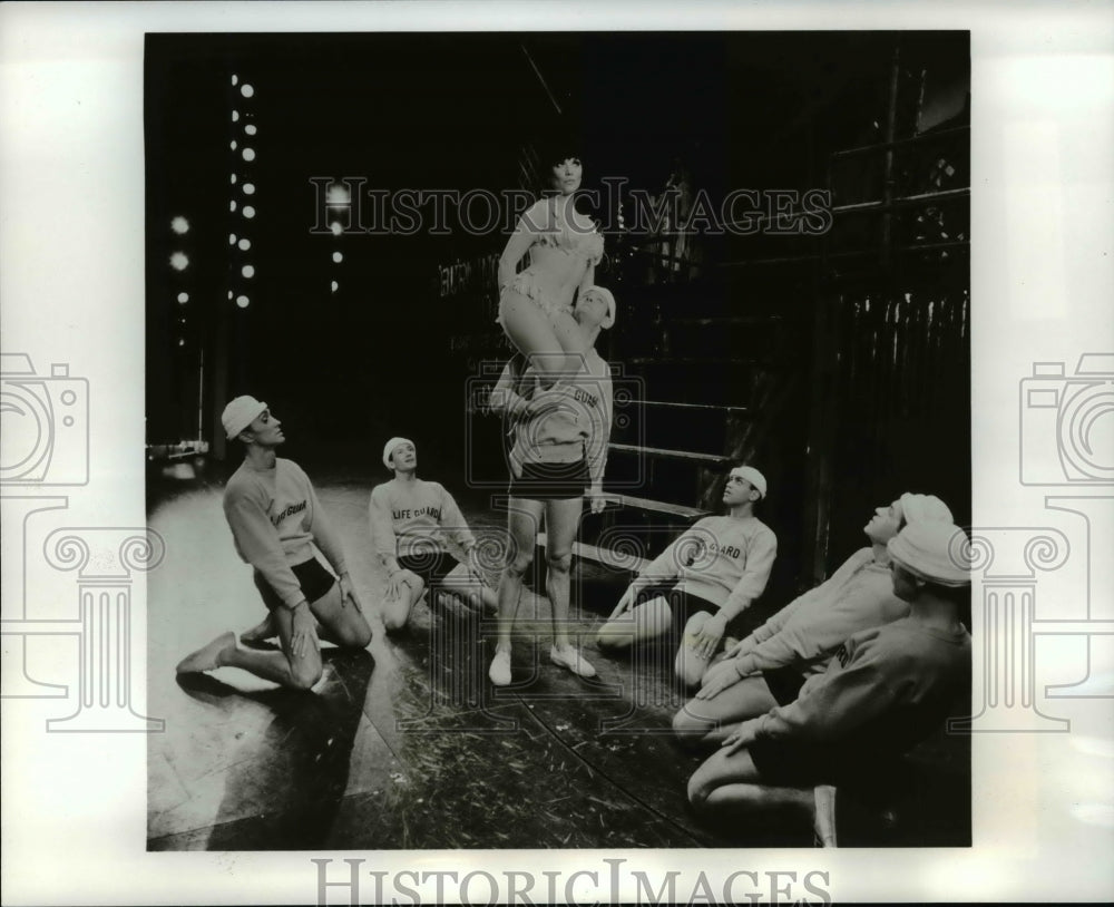  Luba Lisa was lifted by life guards in a scene from I Had A Ball - Historic Images