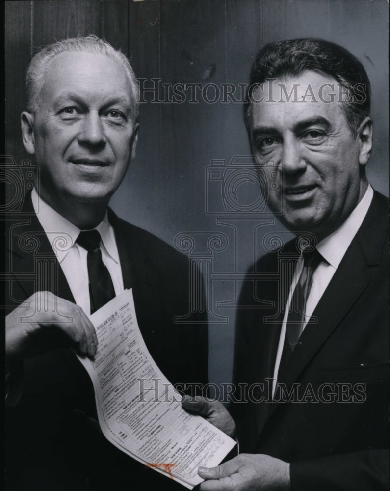 1965 E.W.Glotzbach of I.R.S. accepts tax return from Ralph Perk-Historic Images