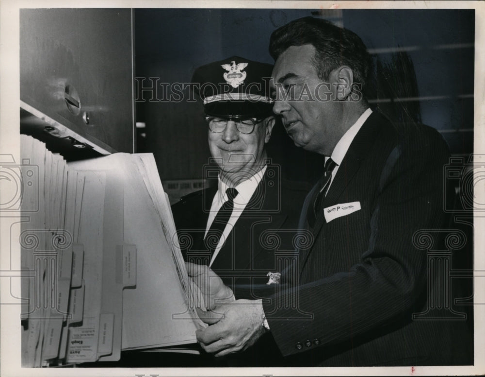 1963 County Auditor Ralph J Perk investigates county payroll records-Historic Images