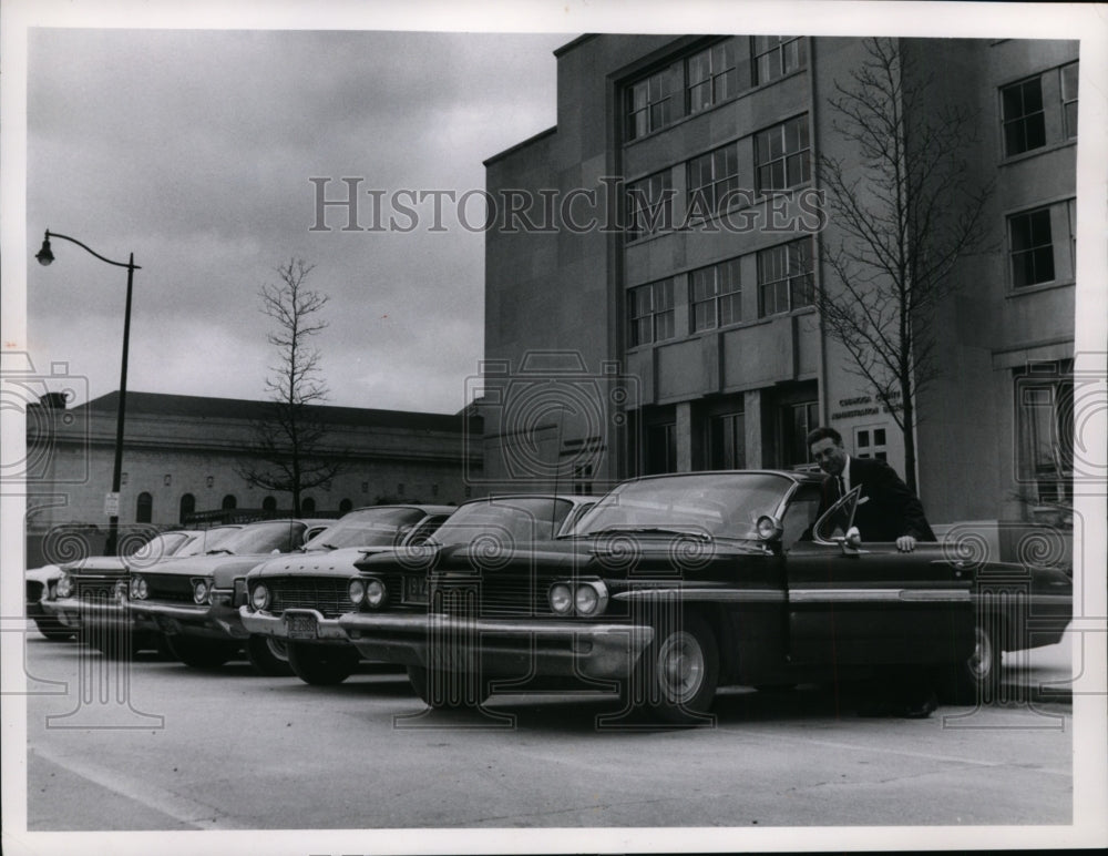 1963 Press Photo County Auditor Ralph J Perk is shown w/ the 5 county owned cars-Historic Images