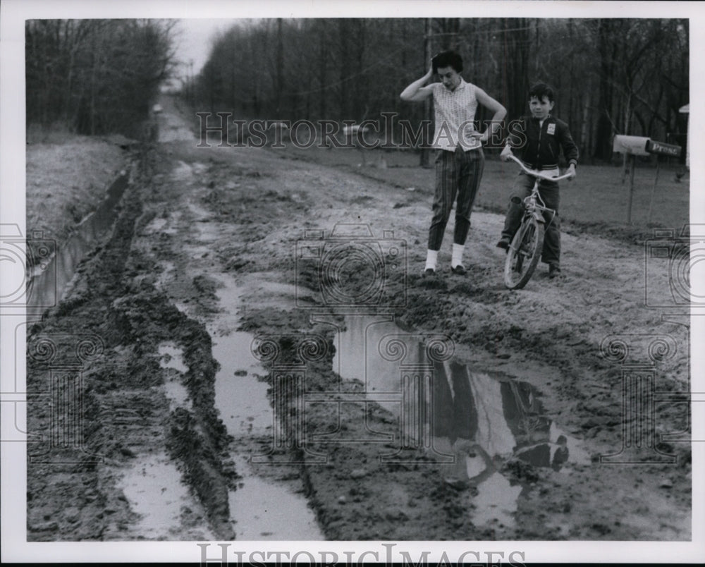 1968 Muddy road after heavy rainfall-Historic Images