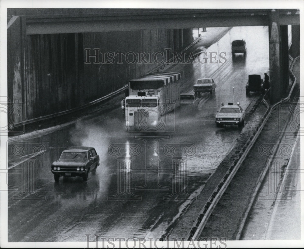 1971, Police car warns motorists of water - cvb33689 - Historic Images