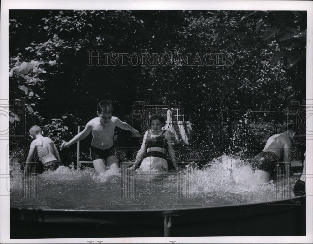 1966 A group of young kids enjoying the swim despite the hot weather-Historic Images