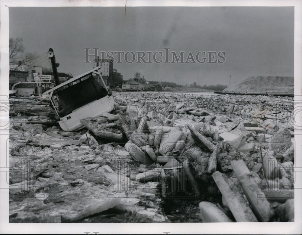 1961 Ice jams against a boat moored along the Grand River-Historic Images