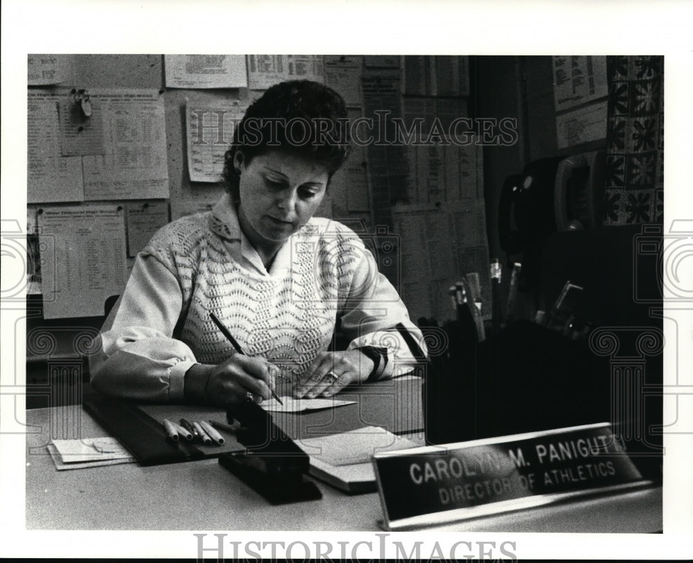 Press Photo Carol Panigutti, Athletic Dir. of West Tech high at her desk - Historic Images