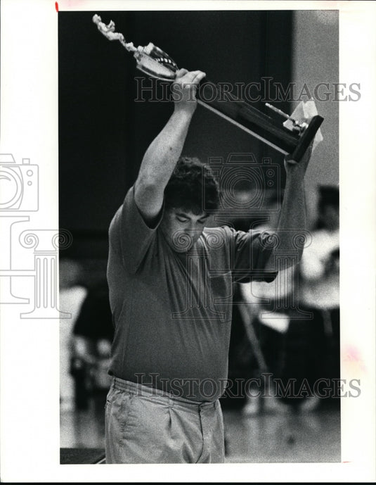 1991 Press Photo Bill Barger wrestling coach from Walsh hold the state trophy - Historic Images