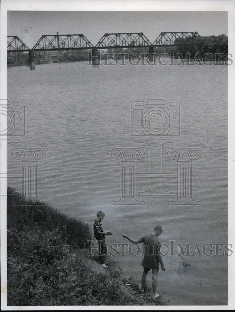 1966,: Children fish at Sandusky River - Freemont - cvb35835 - Historic Images