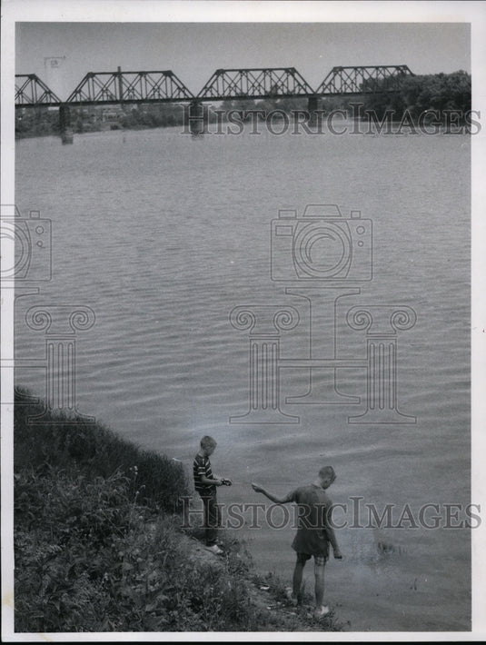 1966,: Children fish at Sandusky River - Freemont - cvb35835 - Historic Images