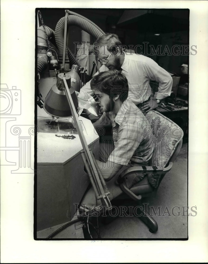 1980, Archeologist examining fossils - cvb36011 - Historic Images