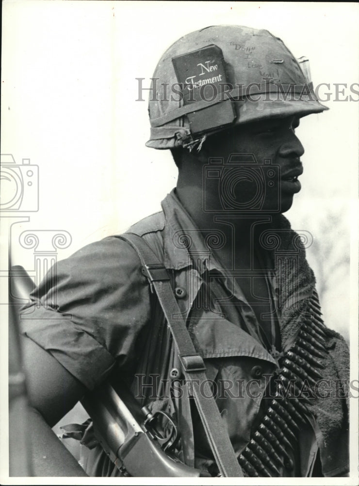 1968 A soldier goes into the Pineapple with a New Testament as guide-Historic Images