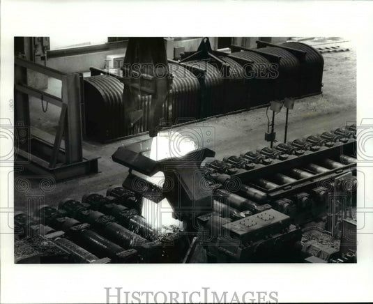 1986 Press Photo: Ingot is dropped on the rolling mill - Timken Faircrest Mill - Historic Images