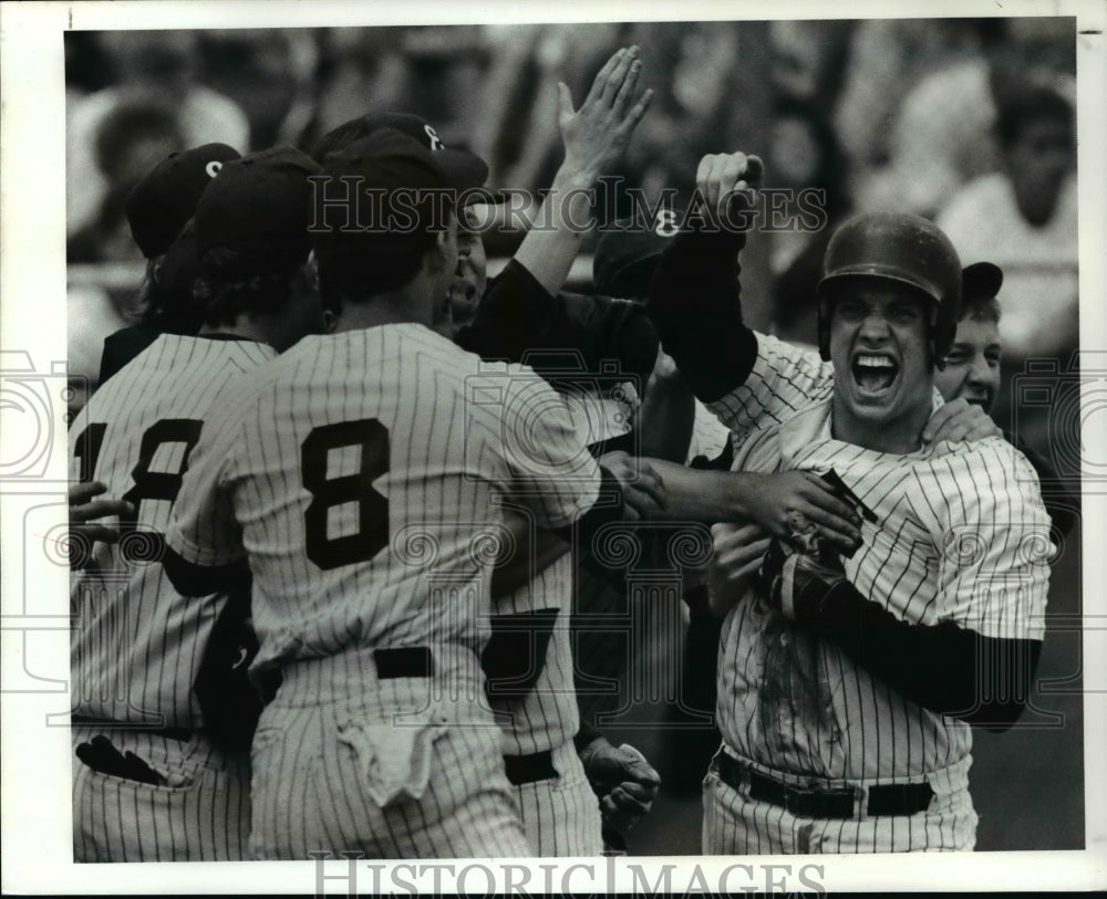 1990 Press Photo Euclid Teammembers celebrates their 9 to 4 victor - cvb41095- Historic Images