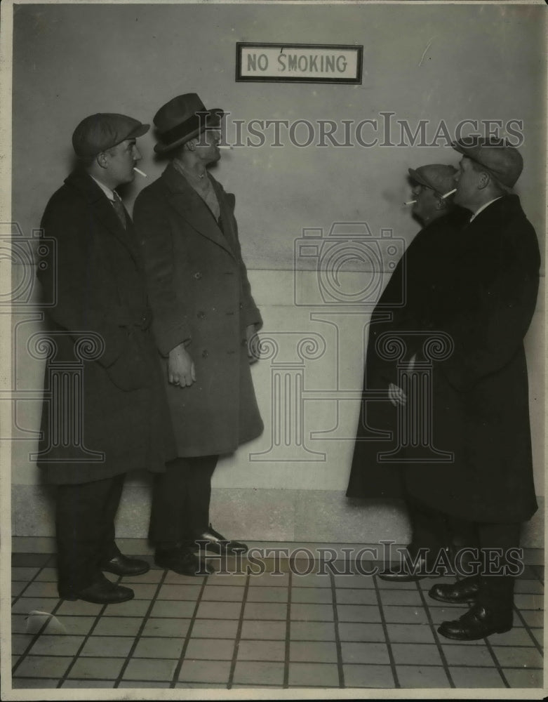 1927, Men in front of the No Smoking sign at Central Police Station - Historic Images