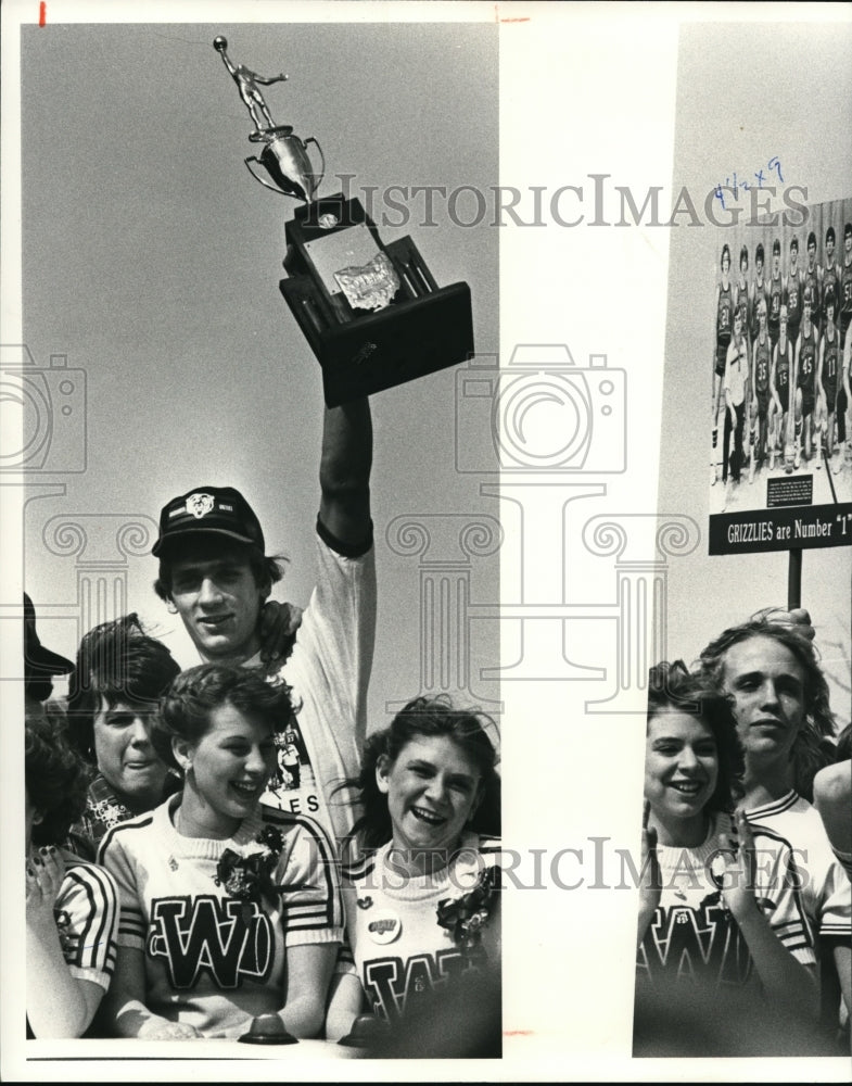 Press PhotoKen Neibuhrm, team co-captain & center on the basketball hold trophy- Historic Images
