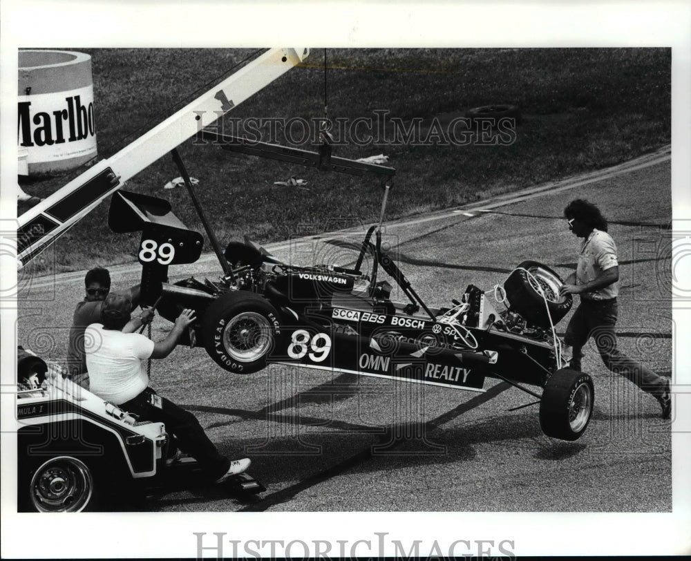 1987 Press Photo Matt McBrides Car is being towed of the track - cvb45492 - Historic Images