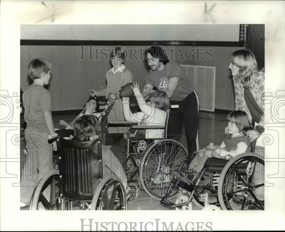 Press Photo Action in Wheel Chair, football - cvb45899 - Historic Images