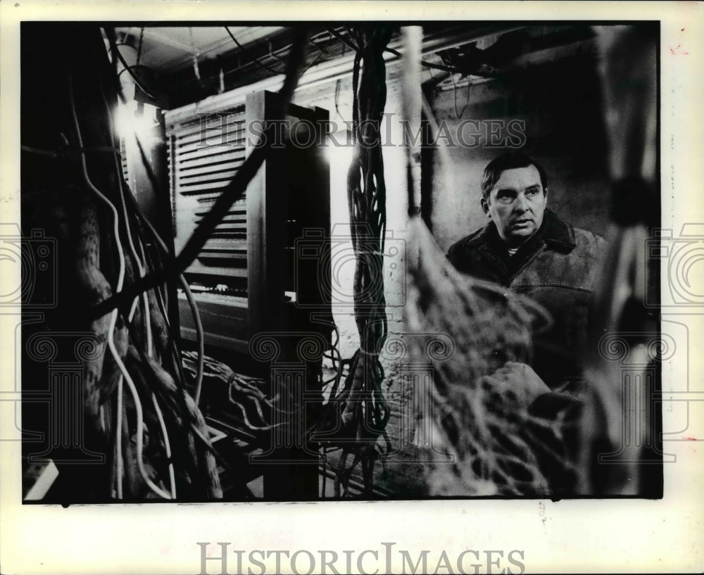 1978, Claude Hawks surrounded by some of the wiring used by the organ - Historic Images